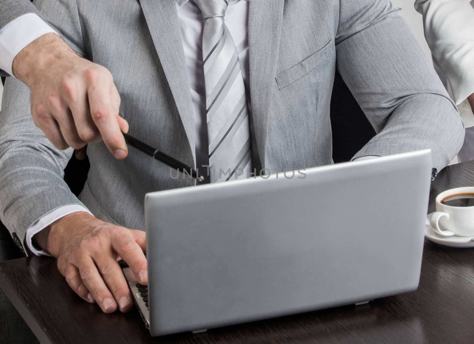 Business team working with laptop together