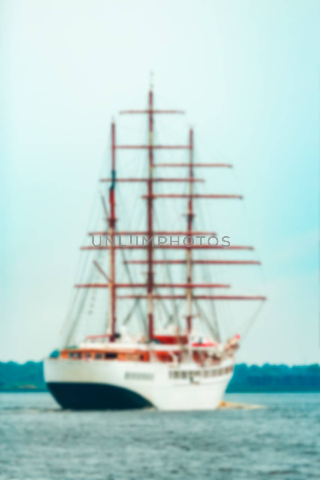 White sailing ship - soft lens bokeh image. Defocused background