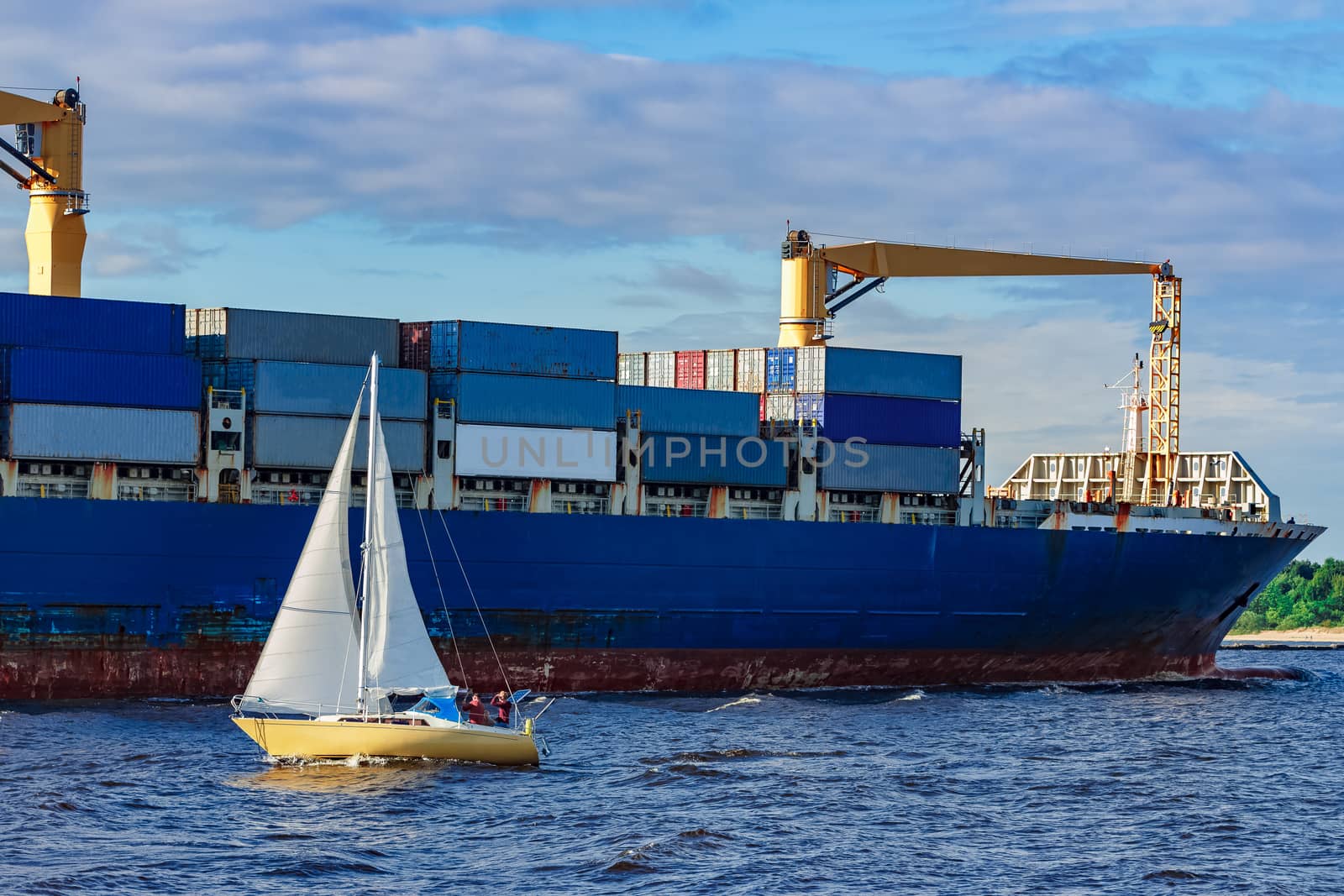 Blue container ship underway by sengnsp