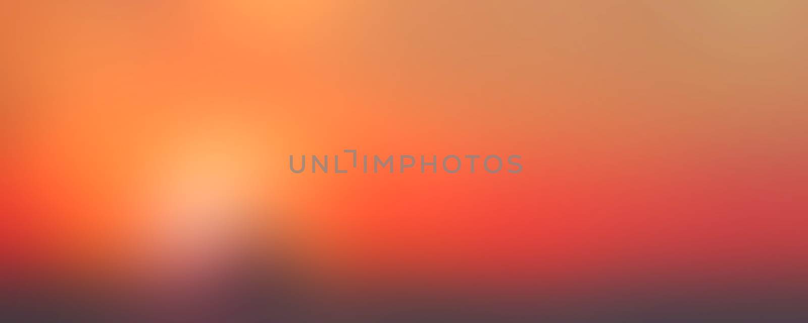 Orange sunset abstract blurred background by sengnsp