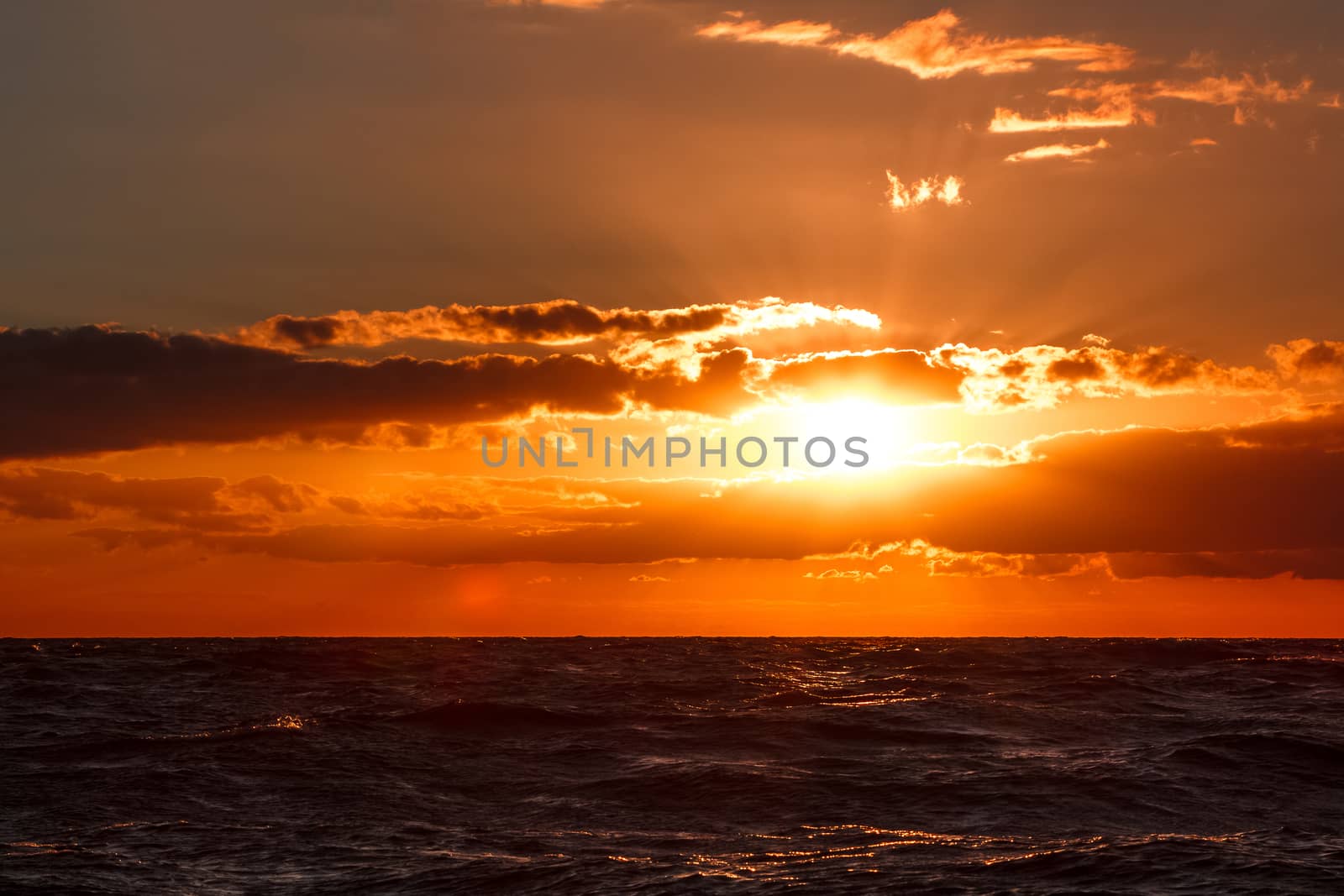 Hot and romantic sunset over the Baltic sea. Calm landscape