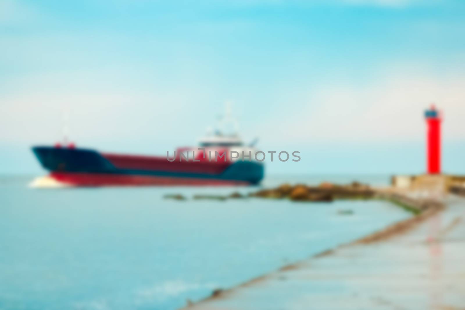 Blue cargo ship - soft lens bokeh image. Defocused background