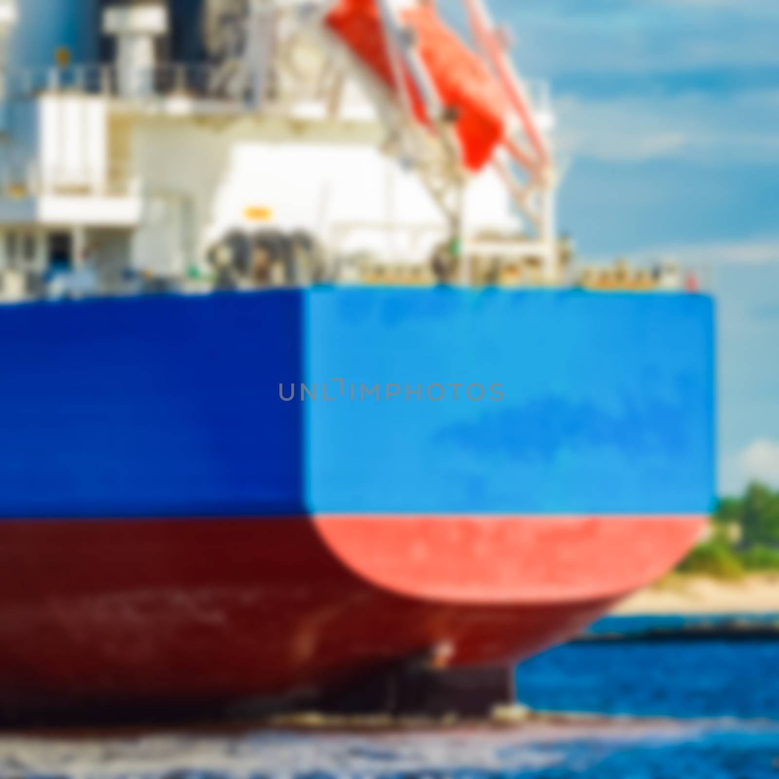 Blue cargo ship - blurred image by sengnsp