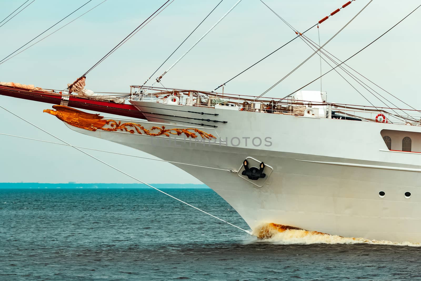 Big white sailing ship with three mast moving to the Riga port