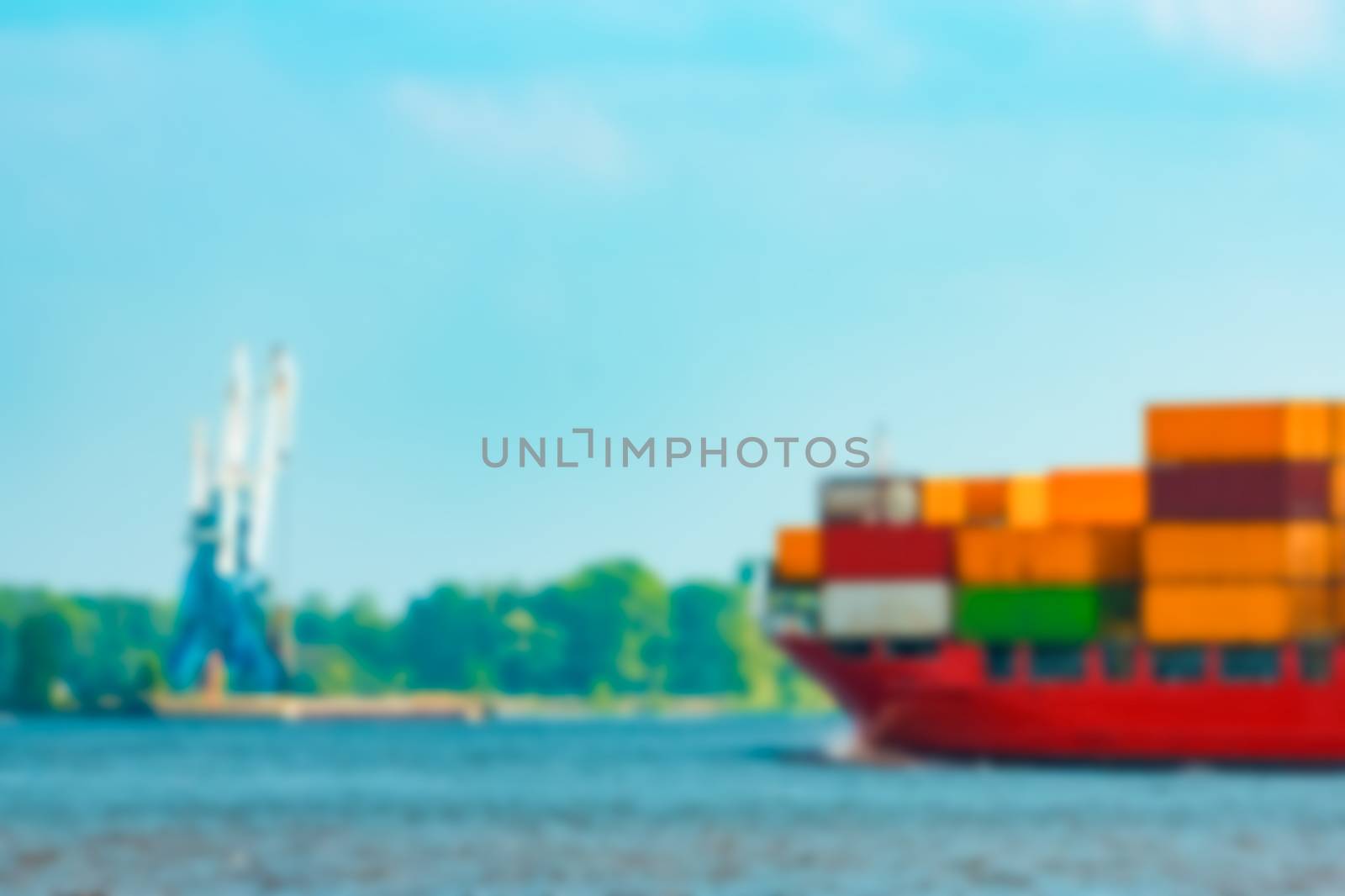 Red cargo ship - soft lens bokeh image. Defocused background