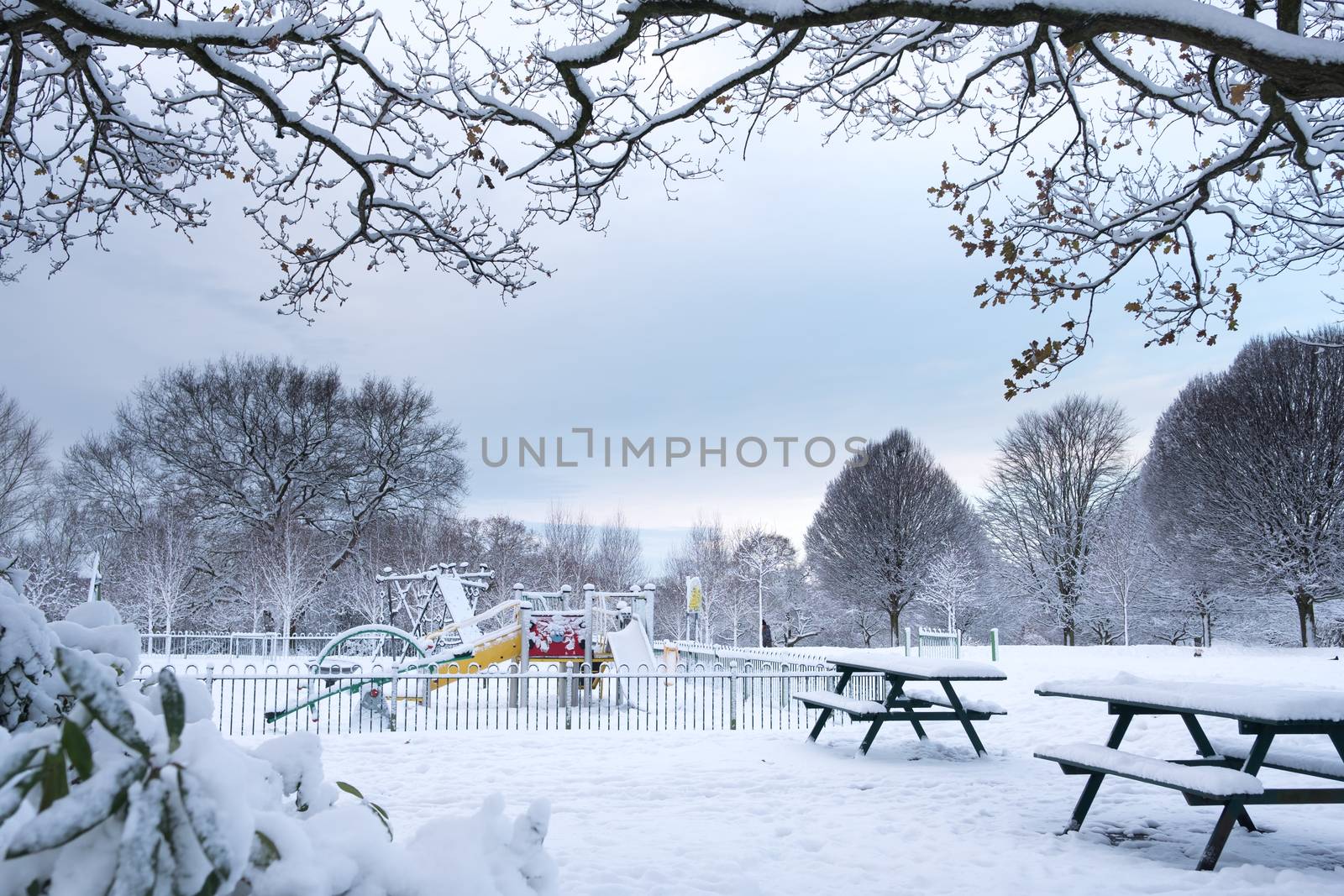 Children playground in Grove Park, Harborne is covered by snow.