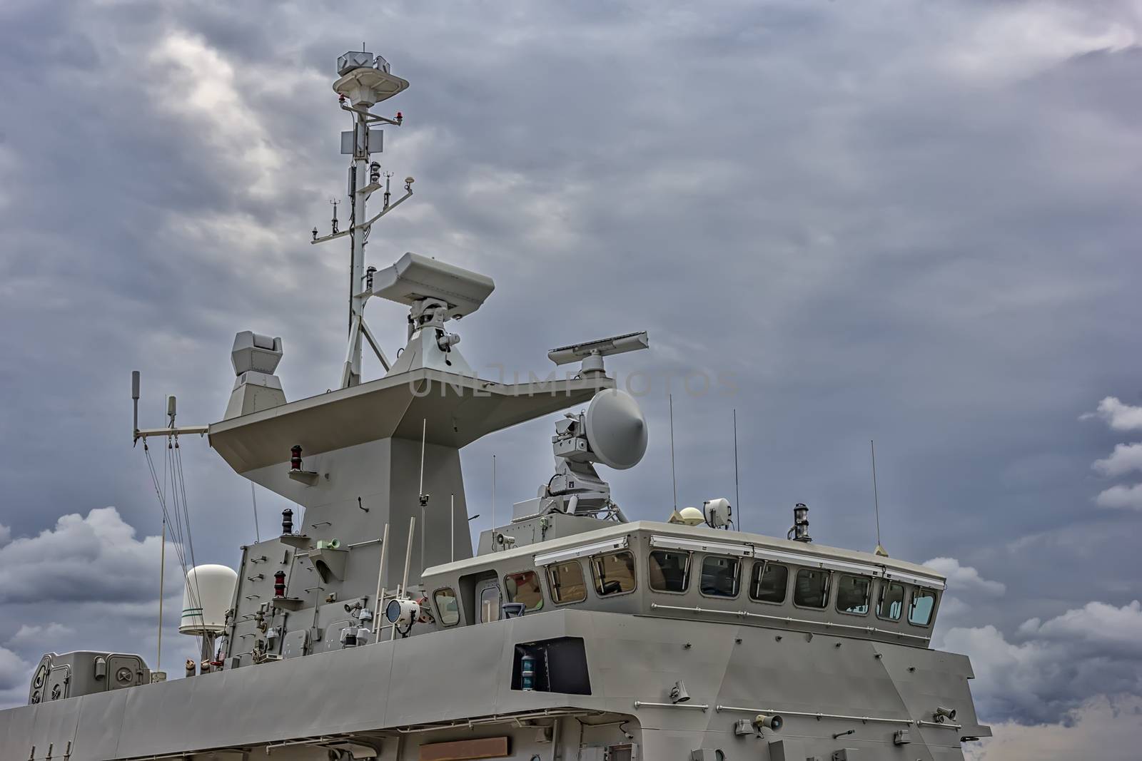 A part of military navy ship. Military sea landscape with cloudy sky