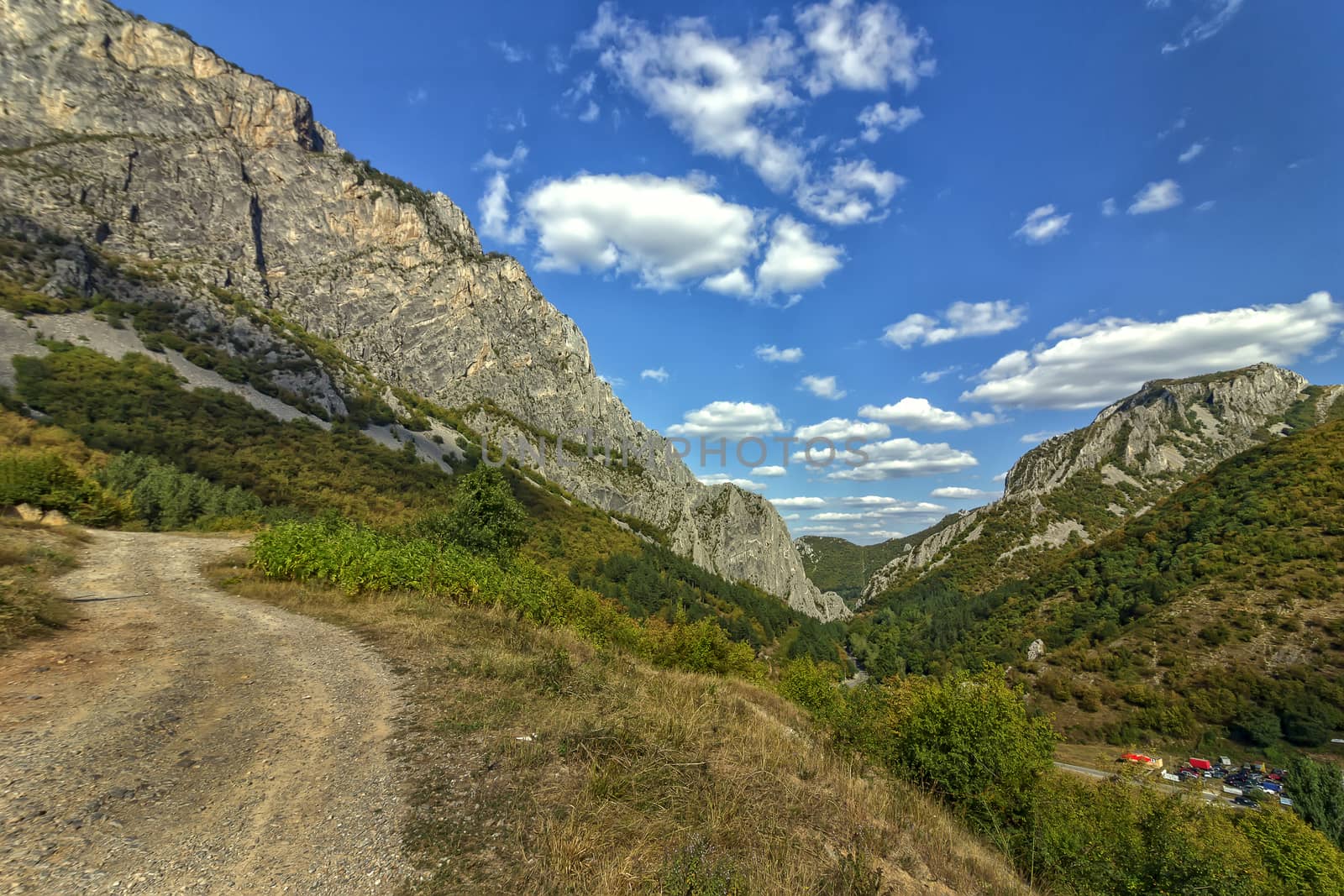 Mountain landscape. Scenic view of a mountain, mountain road and big rocks