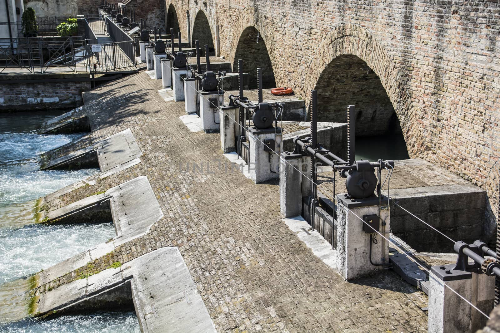 Water flow controller on dam by artofphoto