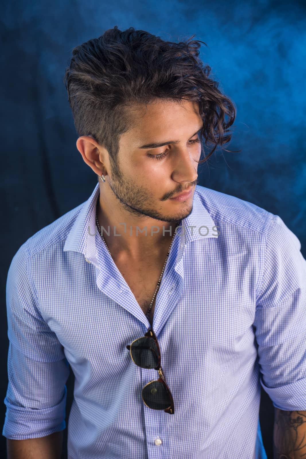 Stylish handsome young man in studio shot by artofphoto