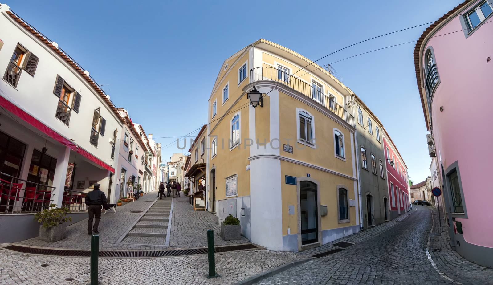 View of the typical architecture buildings from Monchique village with tourist shops and cobblestone streets.