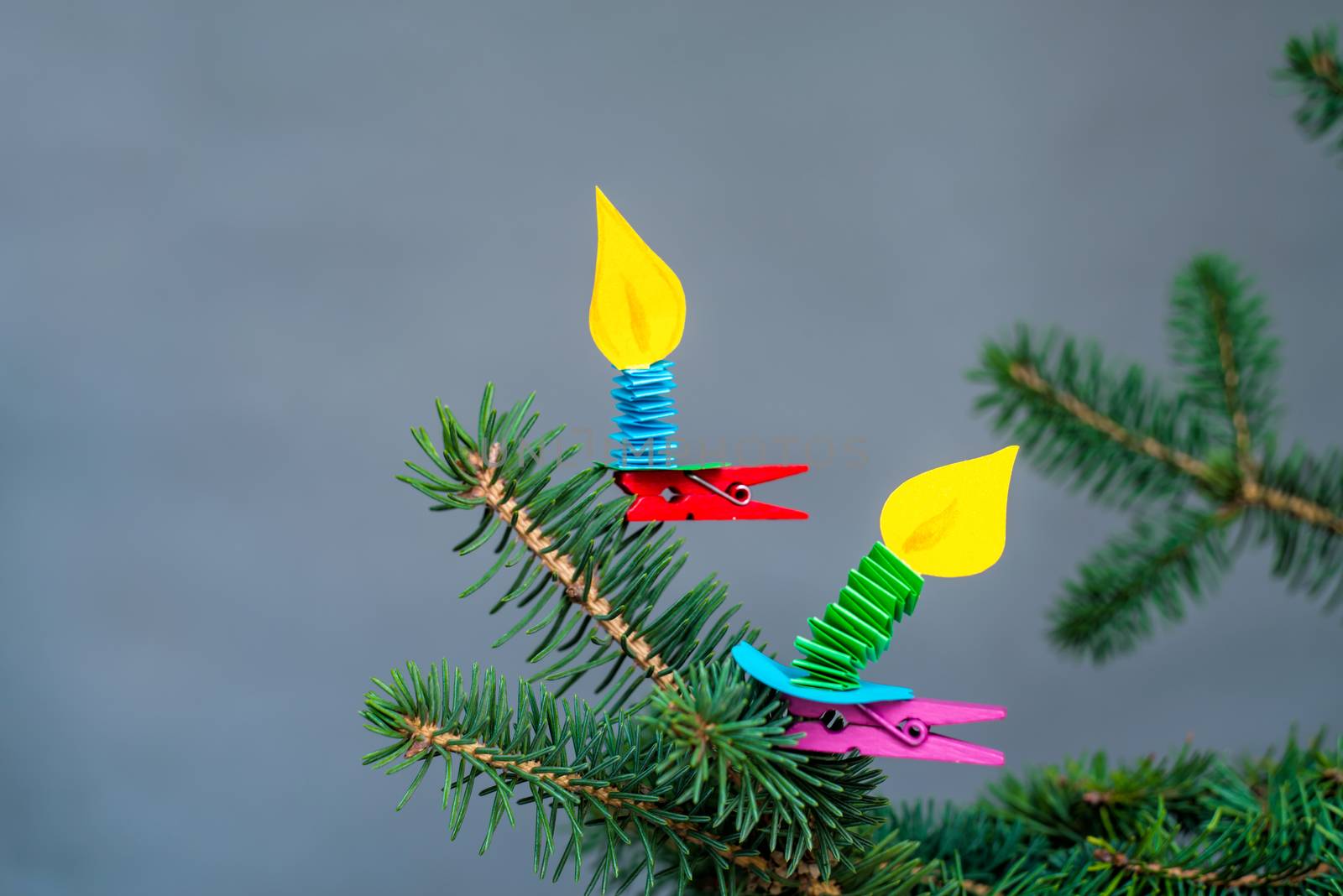 decorative hand made paper candles on clothespins craft on fir tree.christmas crafts by Desperada
