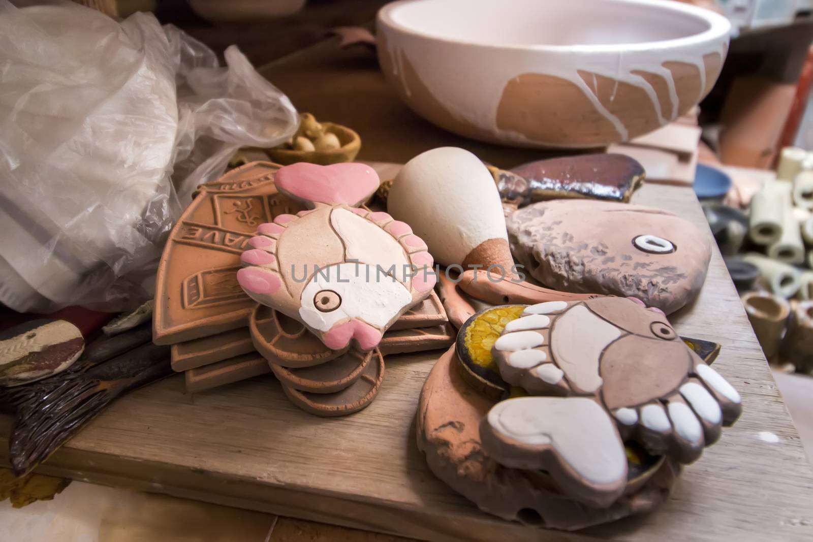 Close up view of souvenir ceramic workshop, with unfinished pieces.