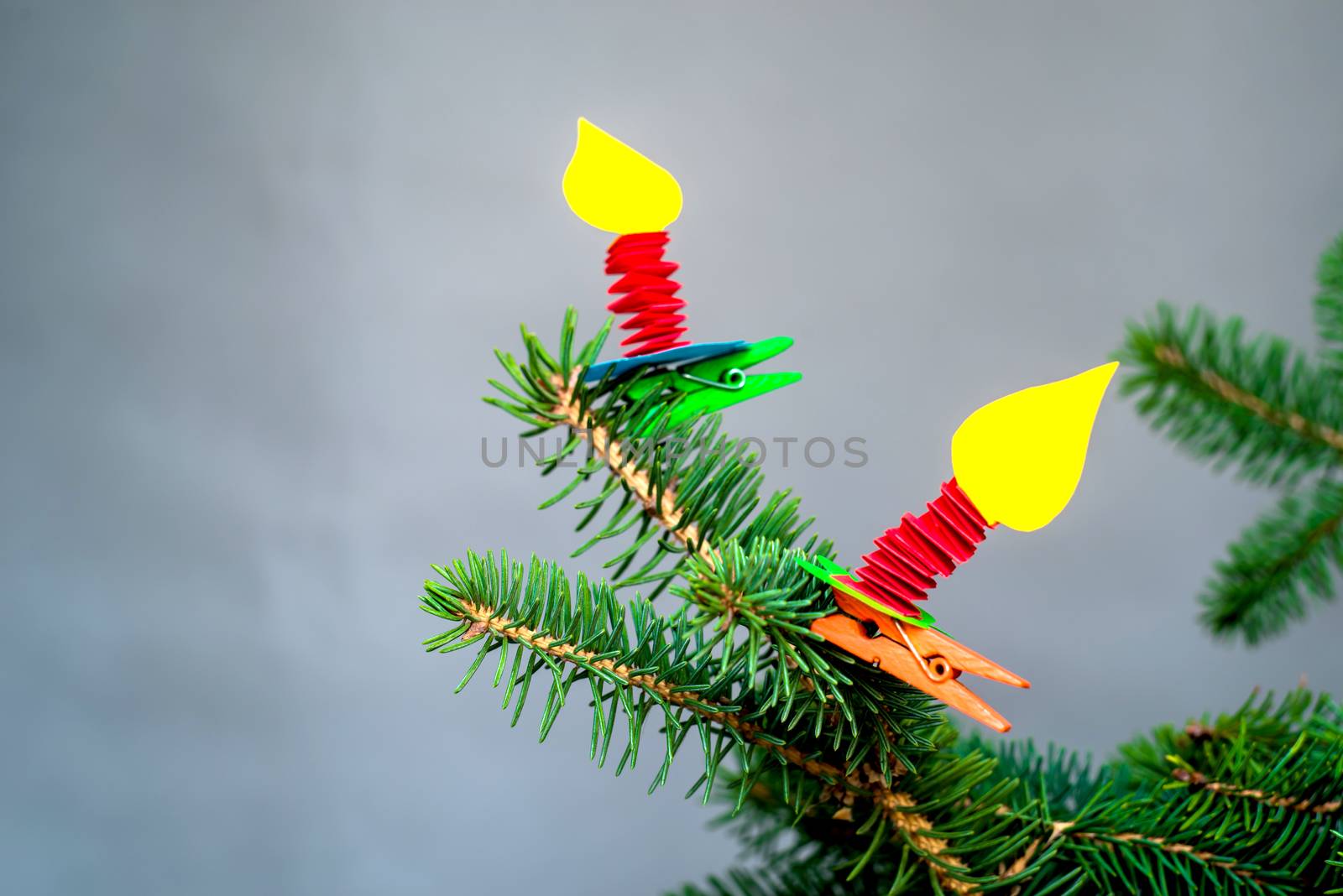 decorative hand made paper candles on clothespins craft on fir tree.christmas crafts by Desperada