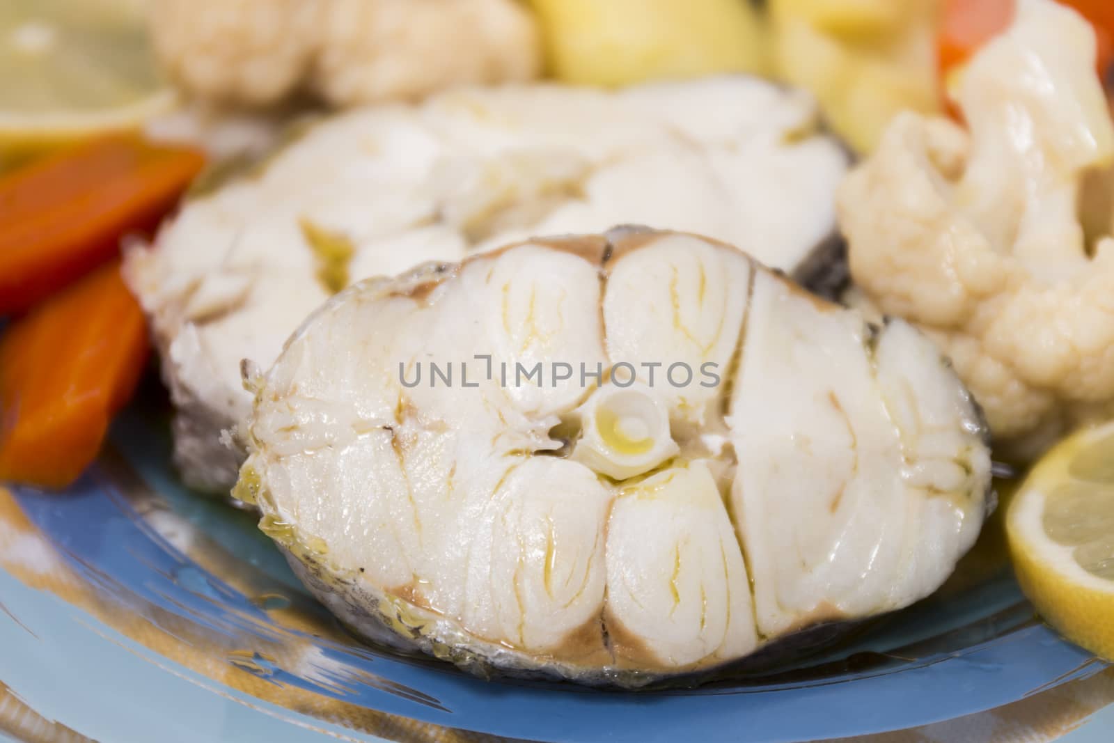 Typical portuguese meal with hake fish with cauliflower, carrots and potatoes.