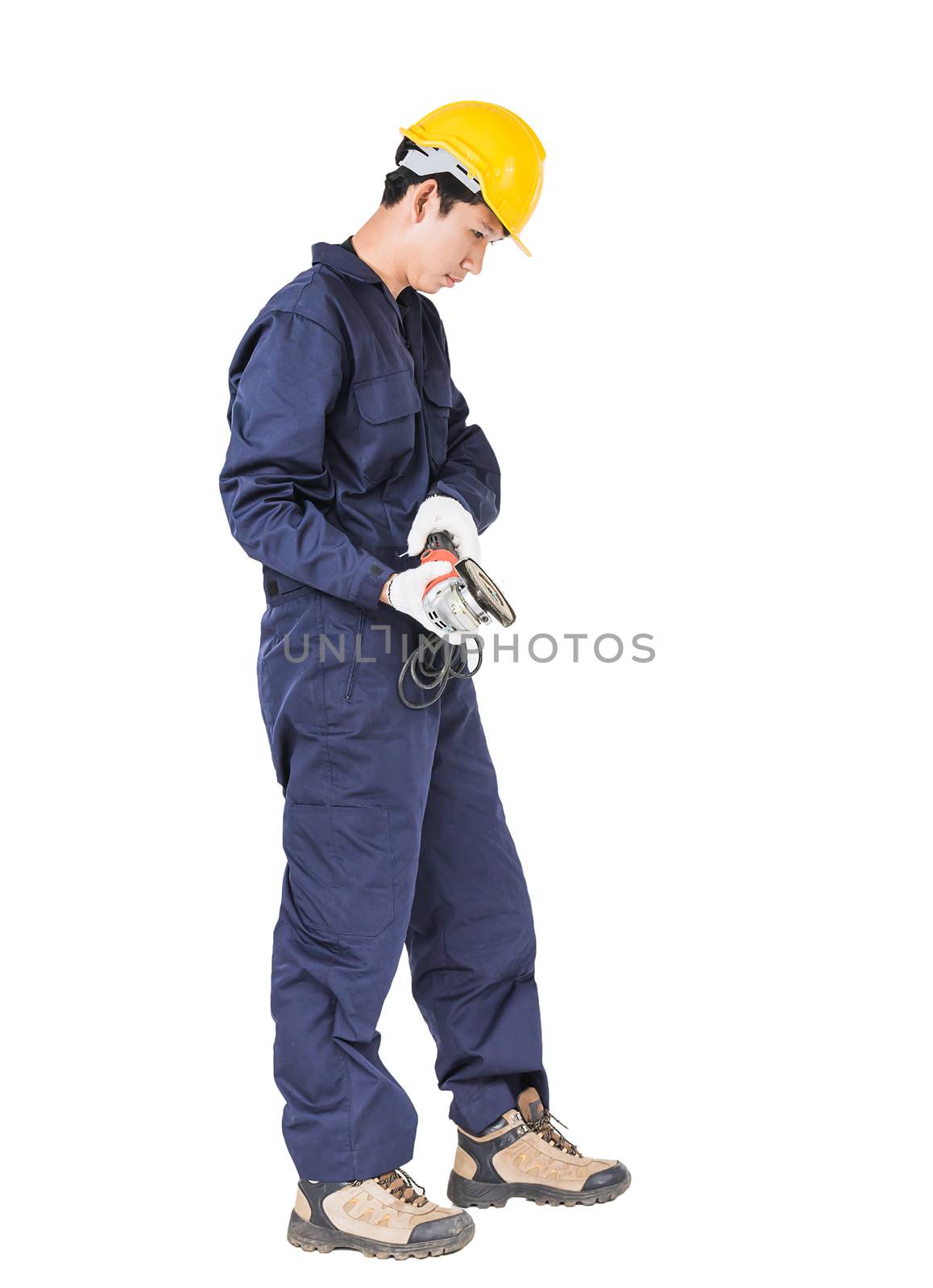 Young handyman in uniform hold grinder, Cutout isolated on white background