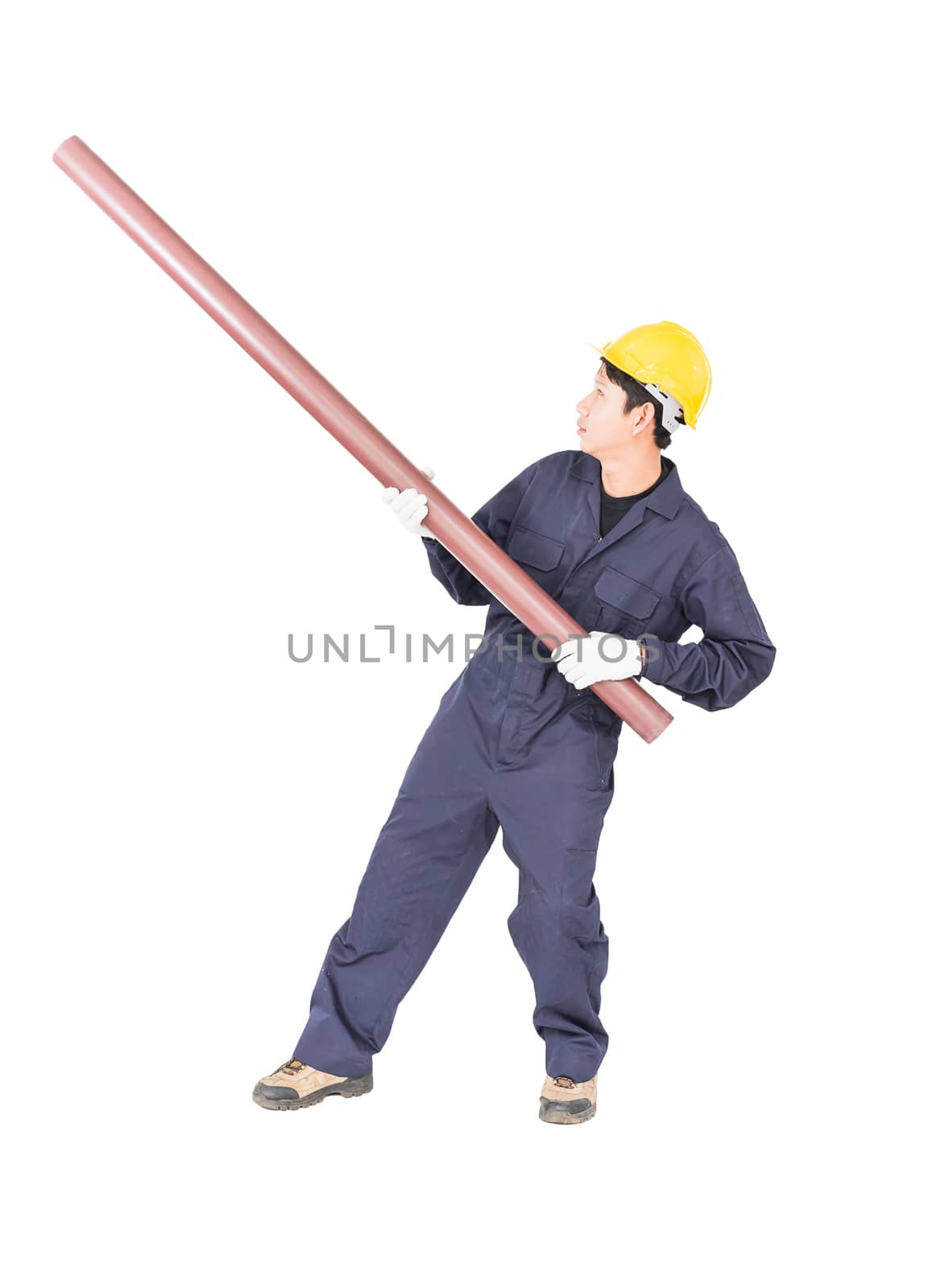 Young plumber in unifrom holding pvc pipe isolated on white background