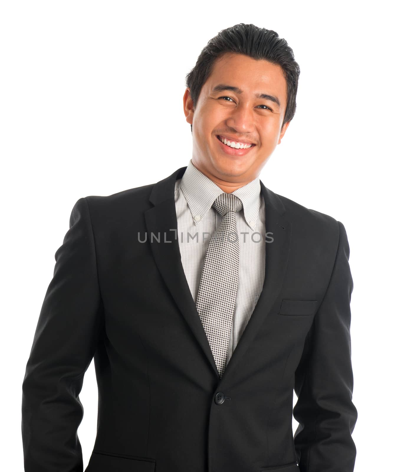 Portrait of attractive young Southeast Asian businessman standing isolated on white background. Asian Malay male model.
