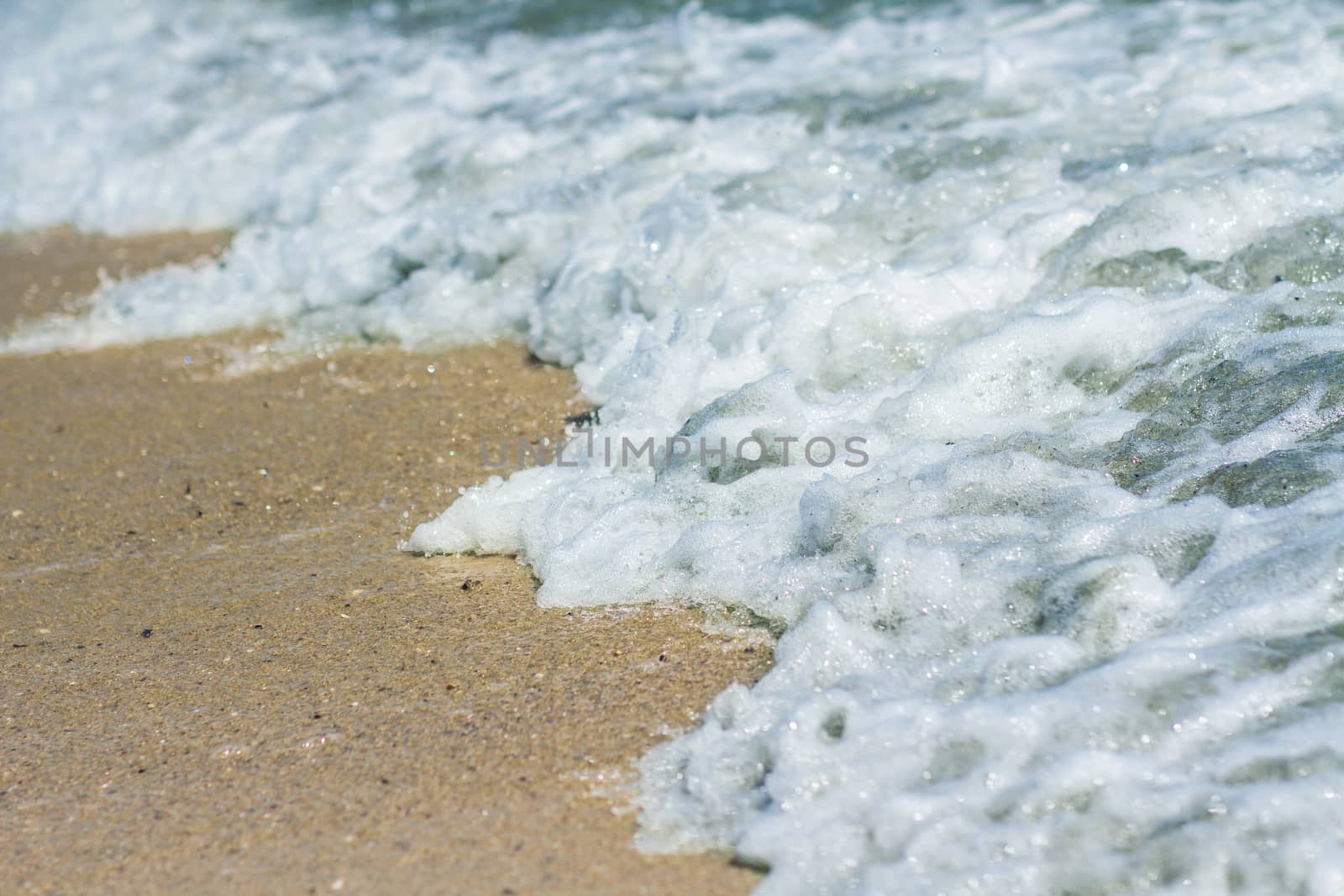 Sand beach and sea foam