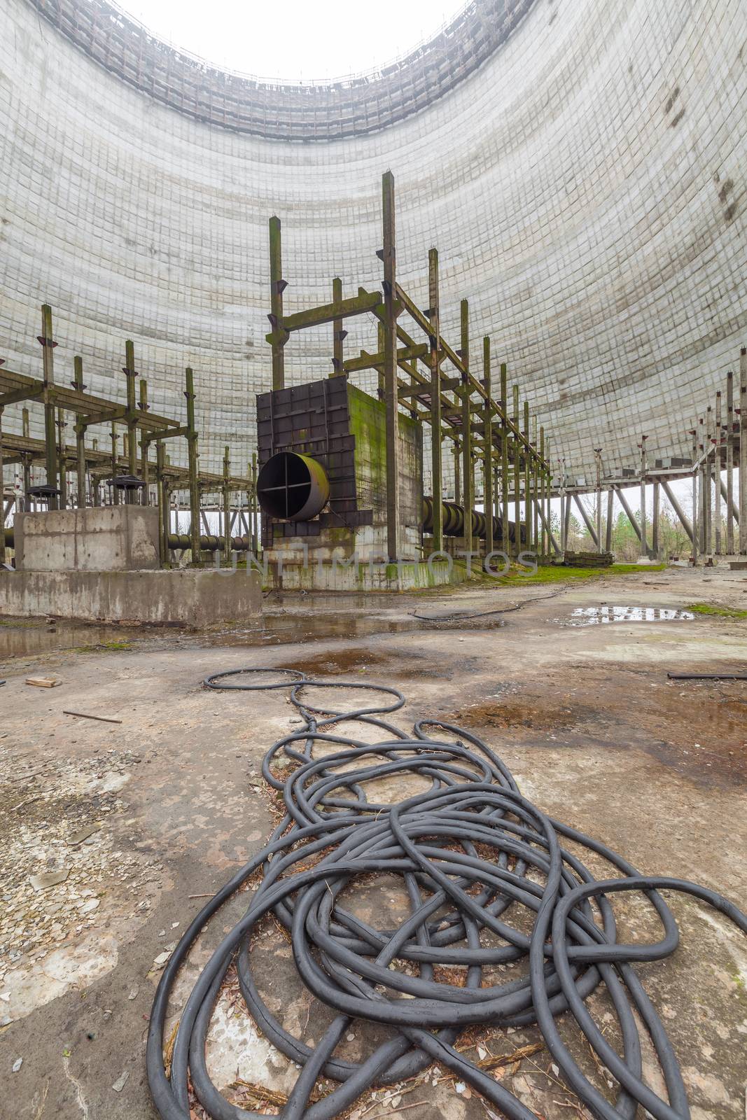 Futuristic view inside of cooling tower of unfinished Chernobyl nuclear power plant by igor_stramyk