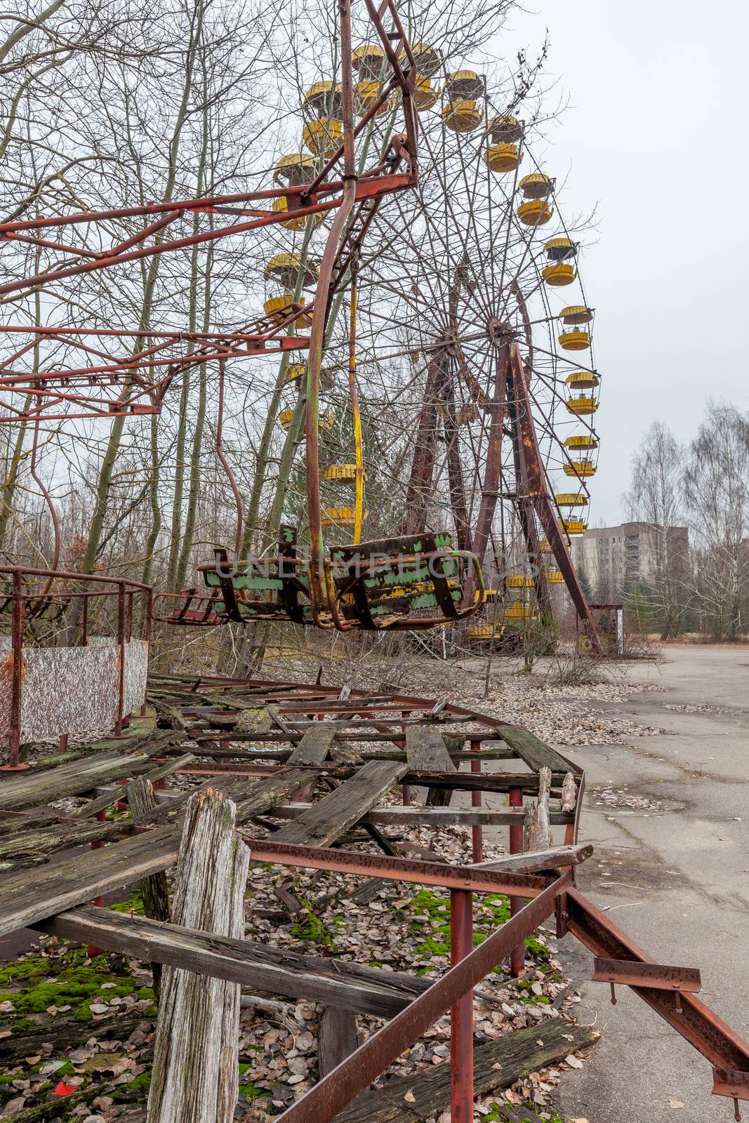 Attraction in amusement park in overgrown ghost city Pripyat. by igor_stramyk