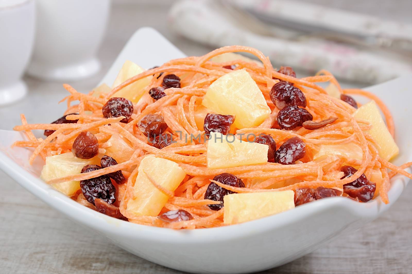 a salad of pineapple, fresh carrots, dried cranberries, yogurt dressed. Gluten free  vegan .