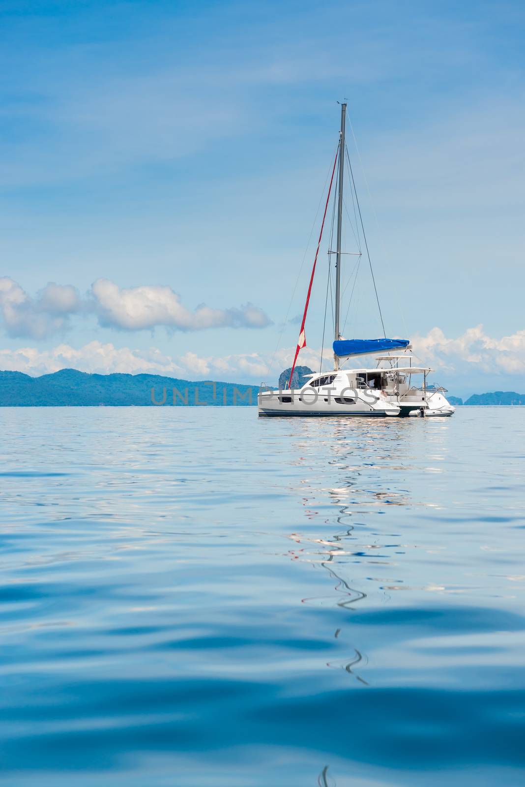 view of the pleasure yacht in the beautiful bay of Thailand, vertical photo