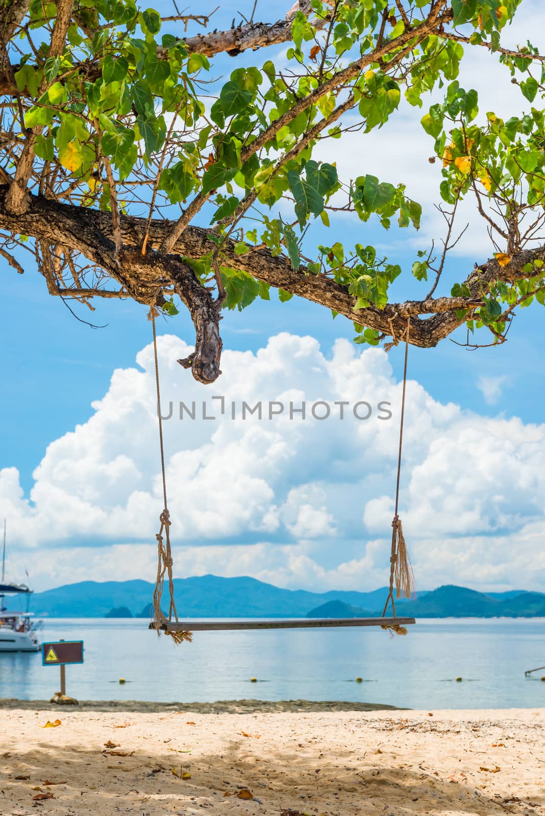 sea landscape with a swing in the foreground, a photo from Thail by kosmsos111