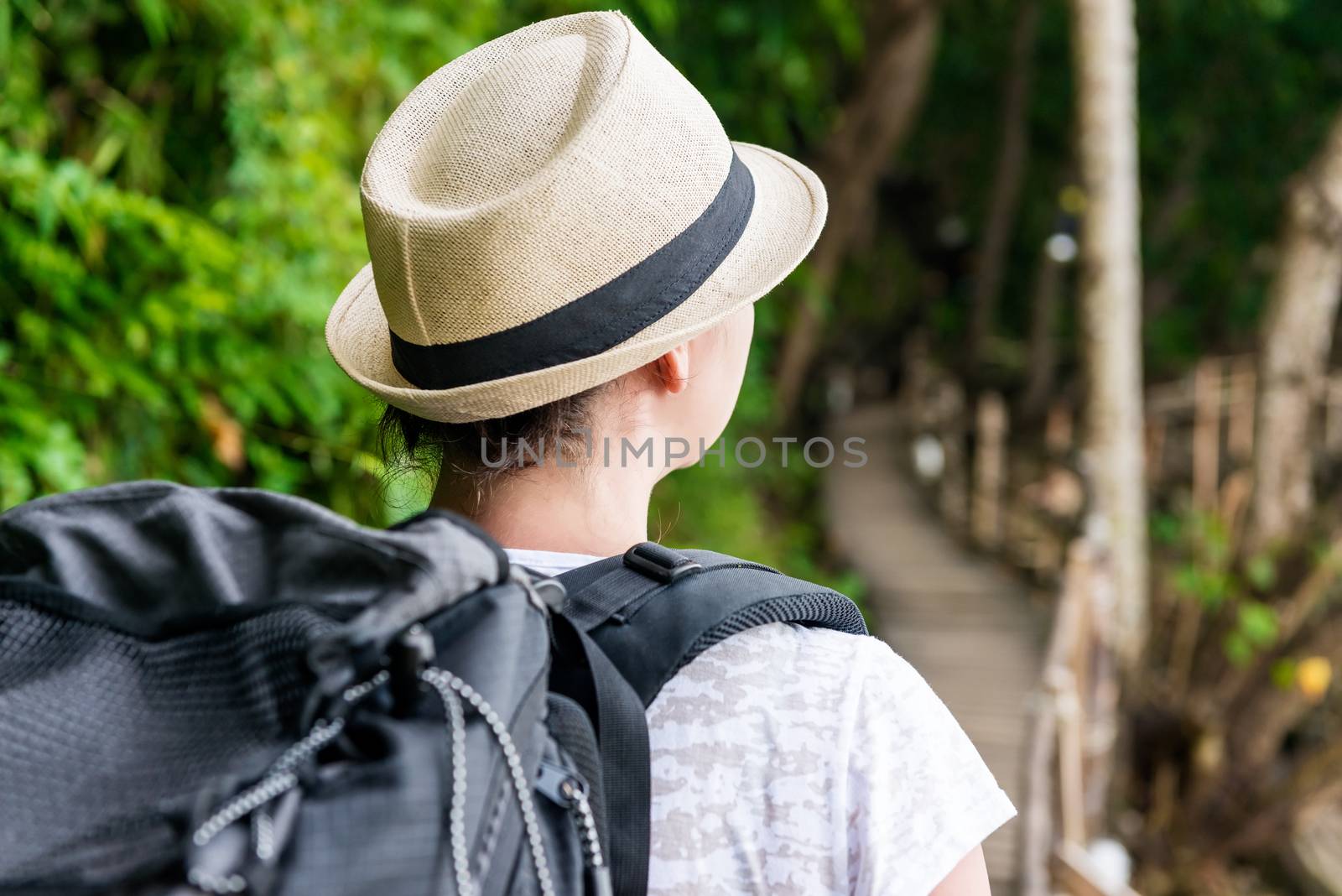 tourist on holiday with a large backpack backpack view back