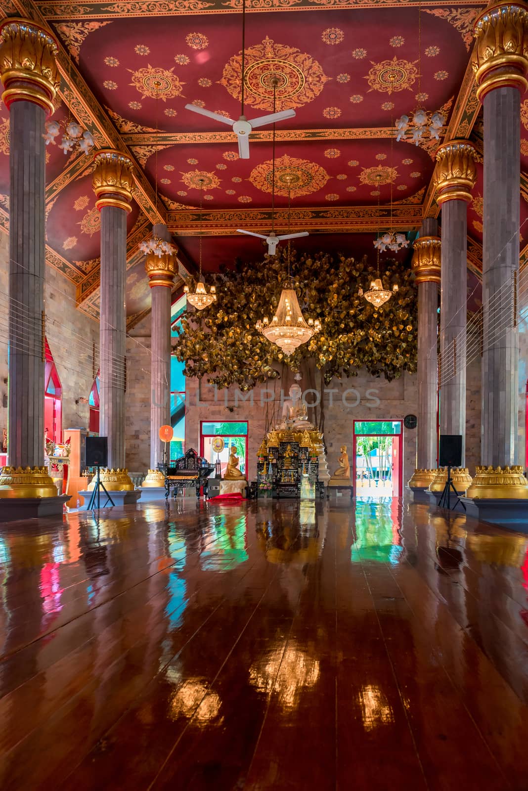 traditional Buddhist temple with a Buddha on the altar in Thailand