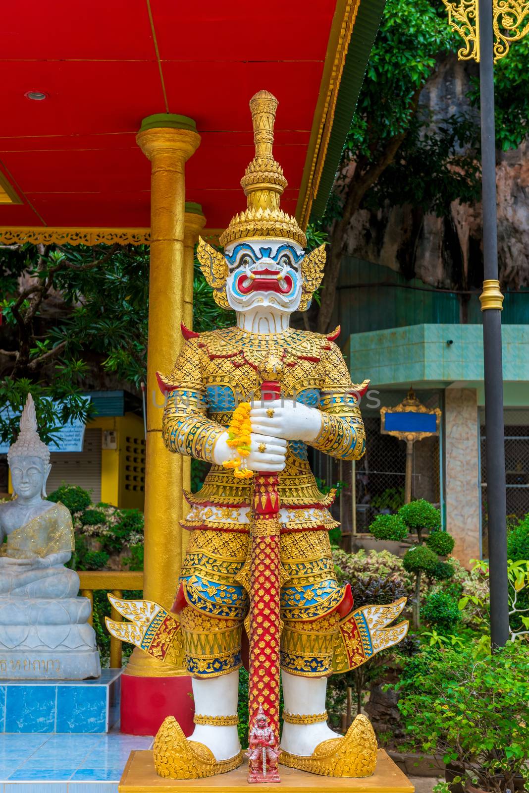 beautiful traditional Thai guard at the temple with Buddha