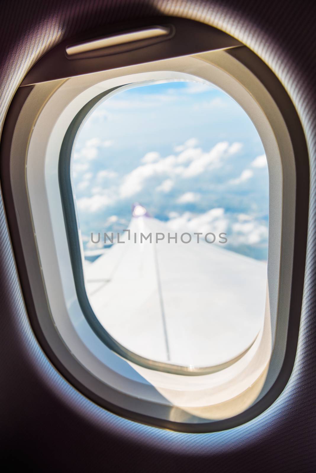 close-up of a plane window in focus