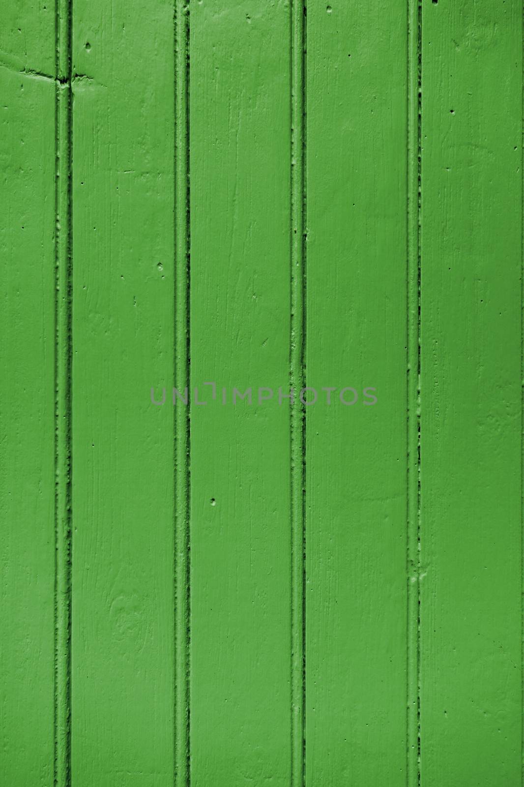 Old wood board painted green by daboost
