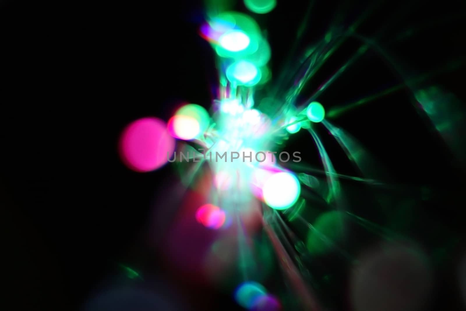 Colorful light explosion on black background. Futuristic wallpaper