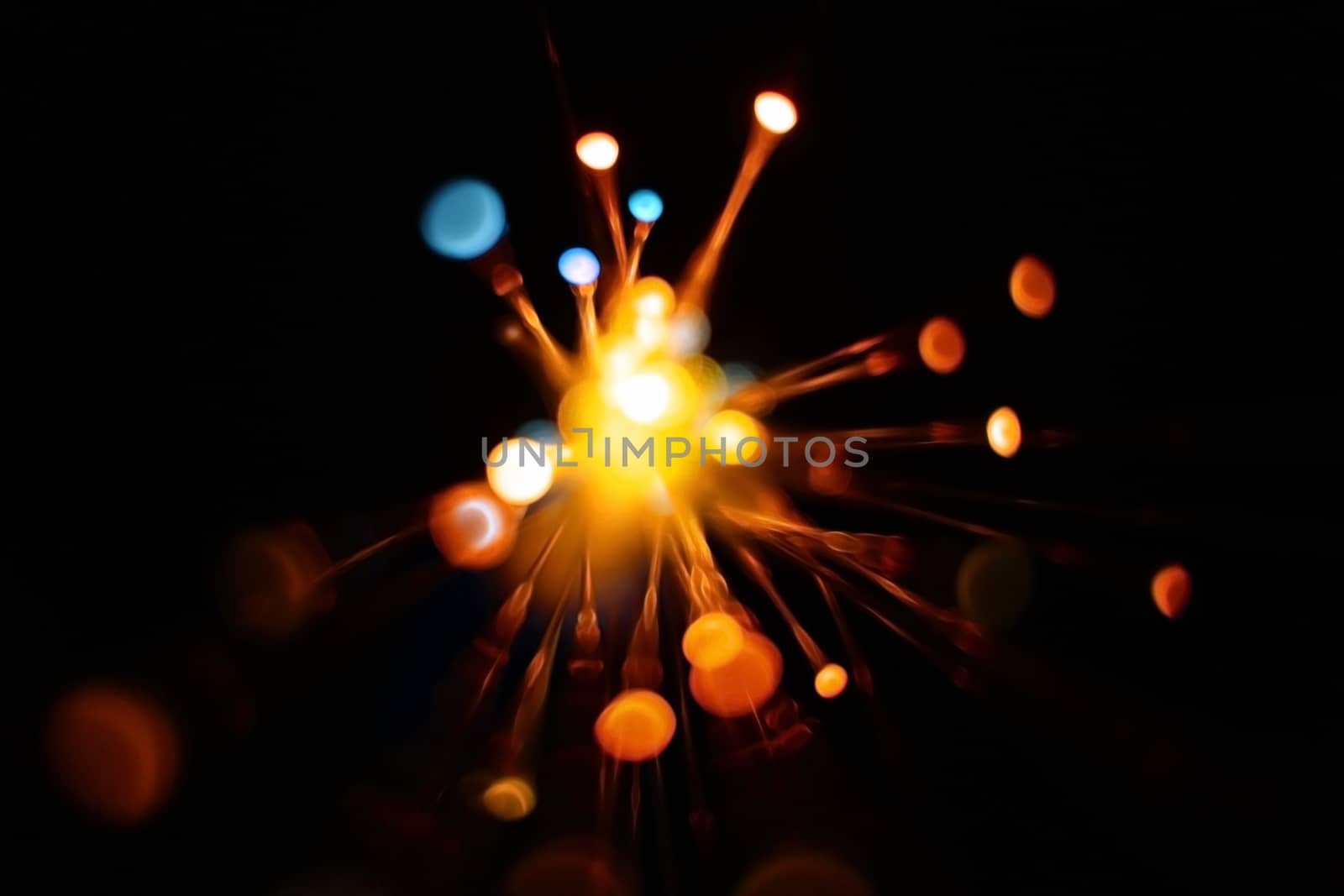 Colorful light explosion on black background. Futuristic wallpaper