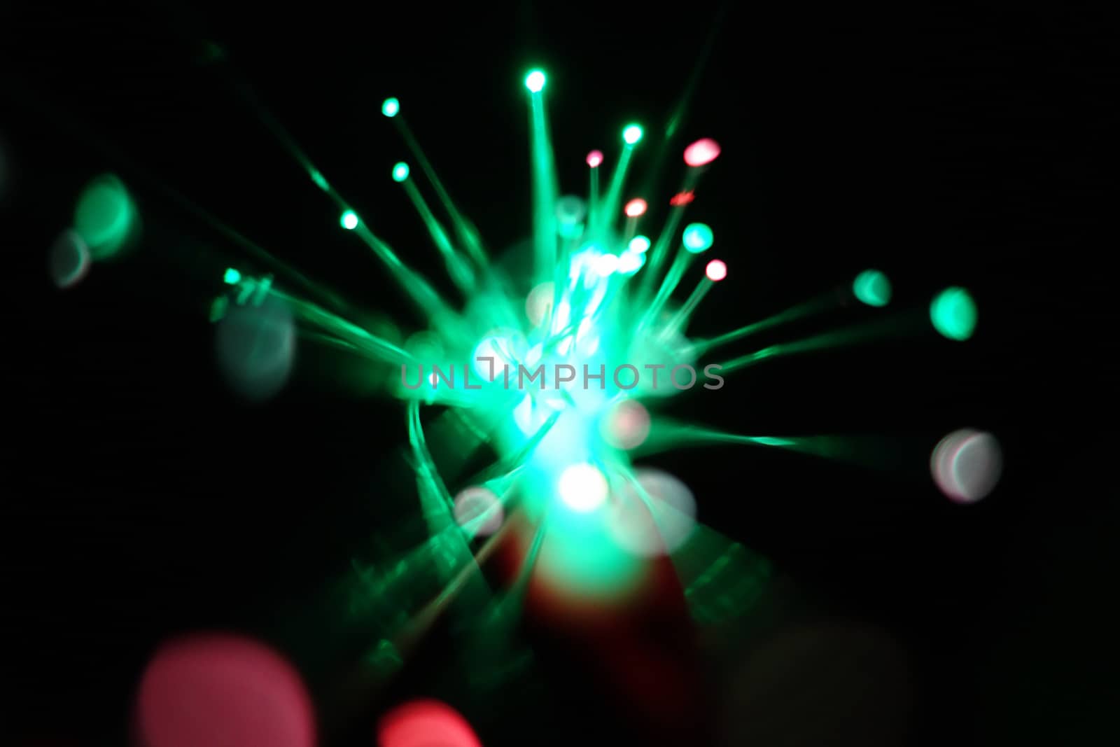 Colorful light explosion on black background. Futuristic wallpaper