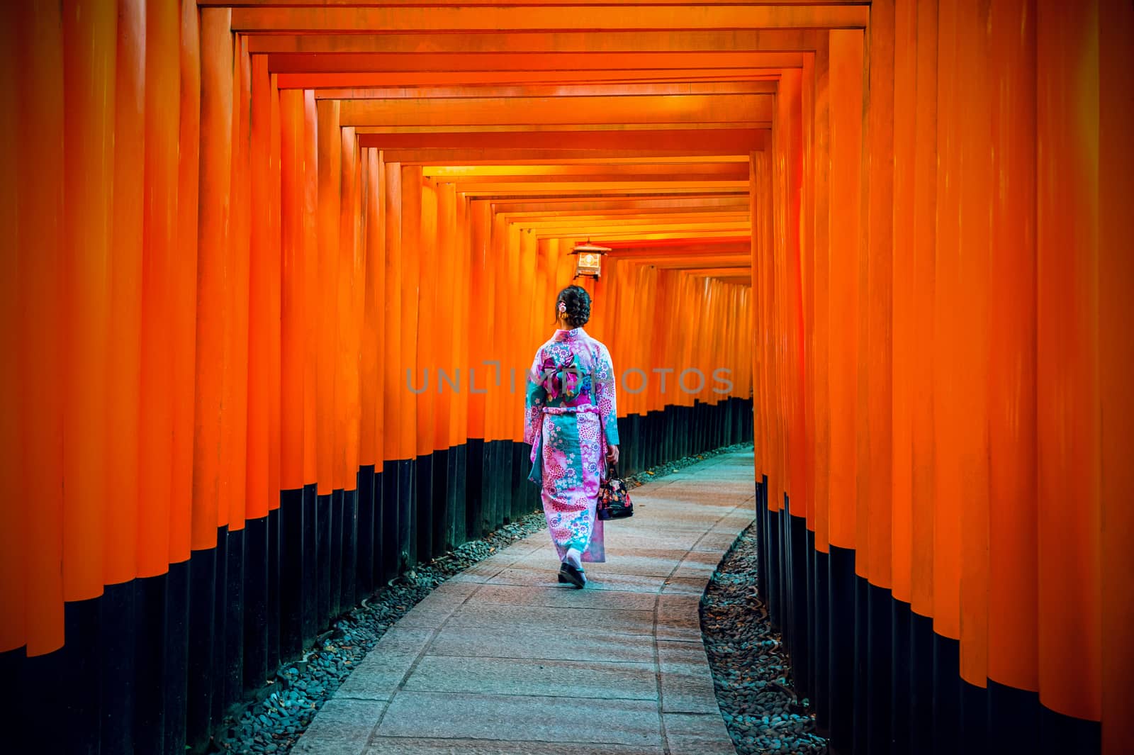 Asian women in traditional japanese kimonos at Fushimi Inari Shrine in Kyoto, Japan. by gutarphotoghaphy