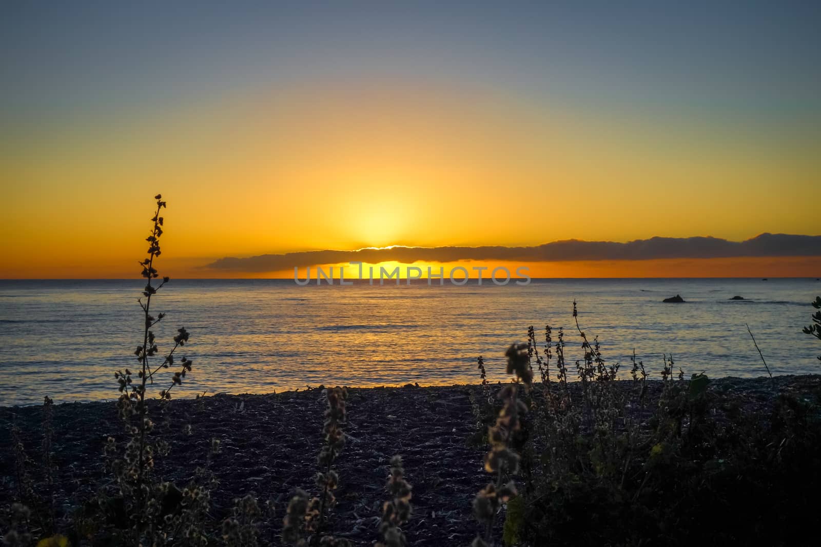 Sunset on Kaikoura beach, New Zealand by daboost