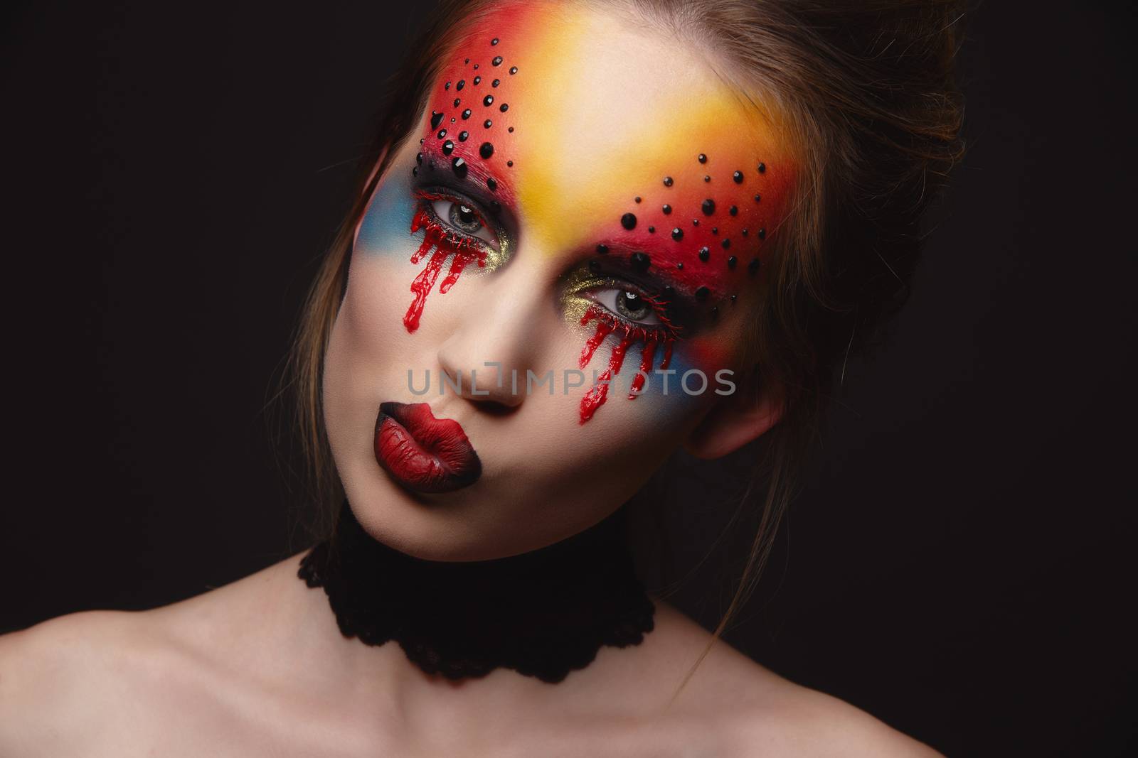 Young female model with bloody eyes makeup by Multipedia