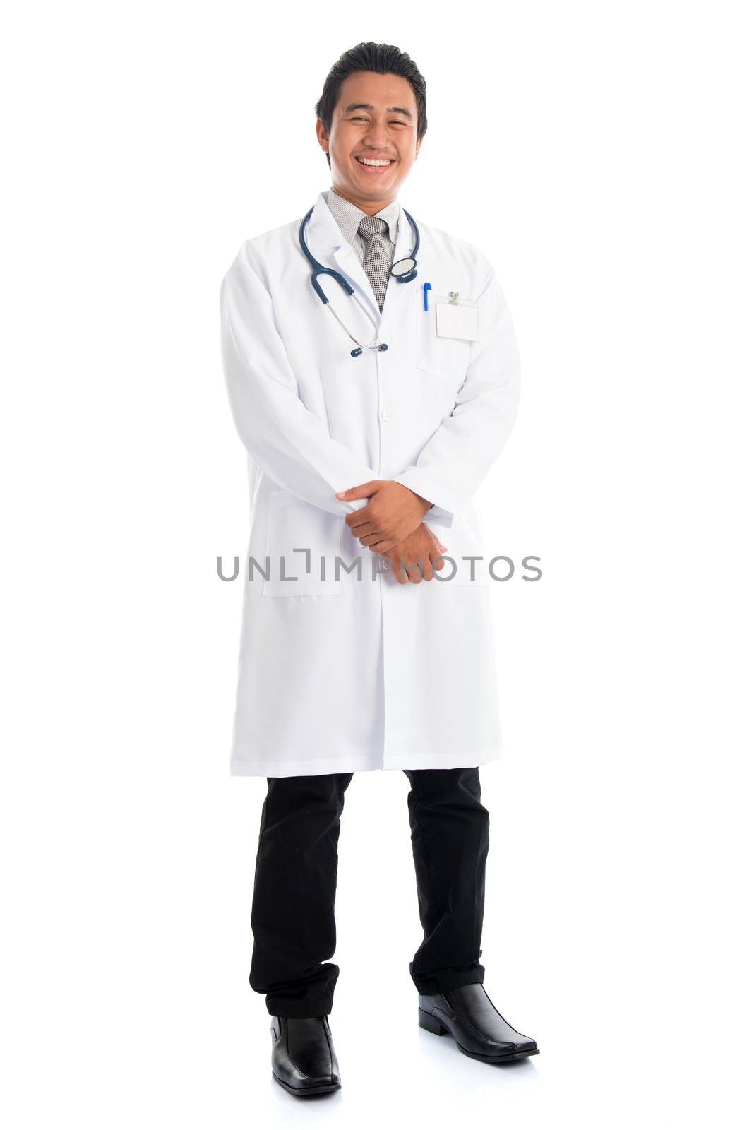 Full body front view attractive young male Southeast Asian medical doctor standing isolated on white background.