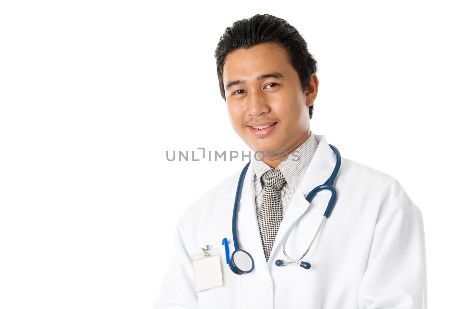 Portrait of attractive young male Southeast Asian medical doctor standing isolated on white background.