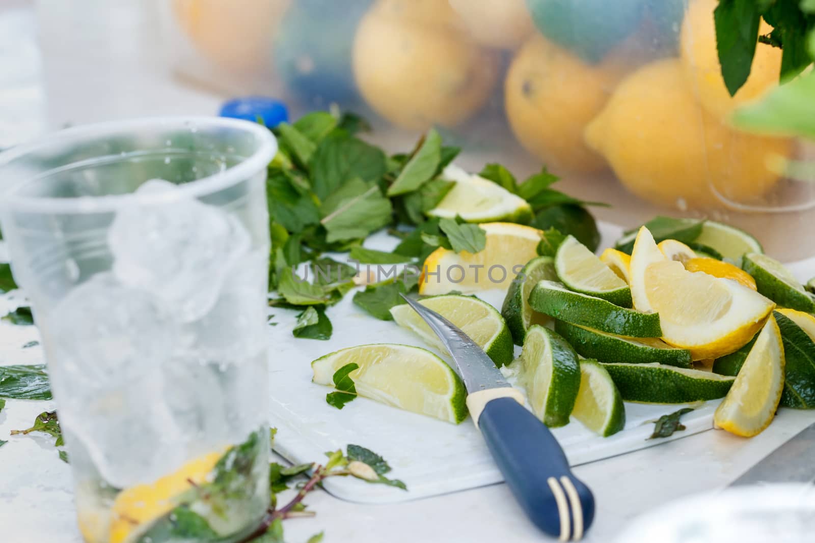 Fresh chopped ingredients for a refreshing cocktail with ice by fogen