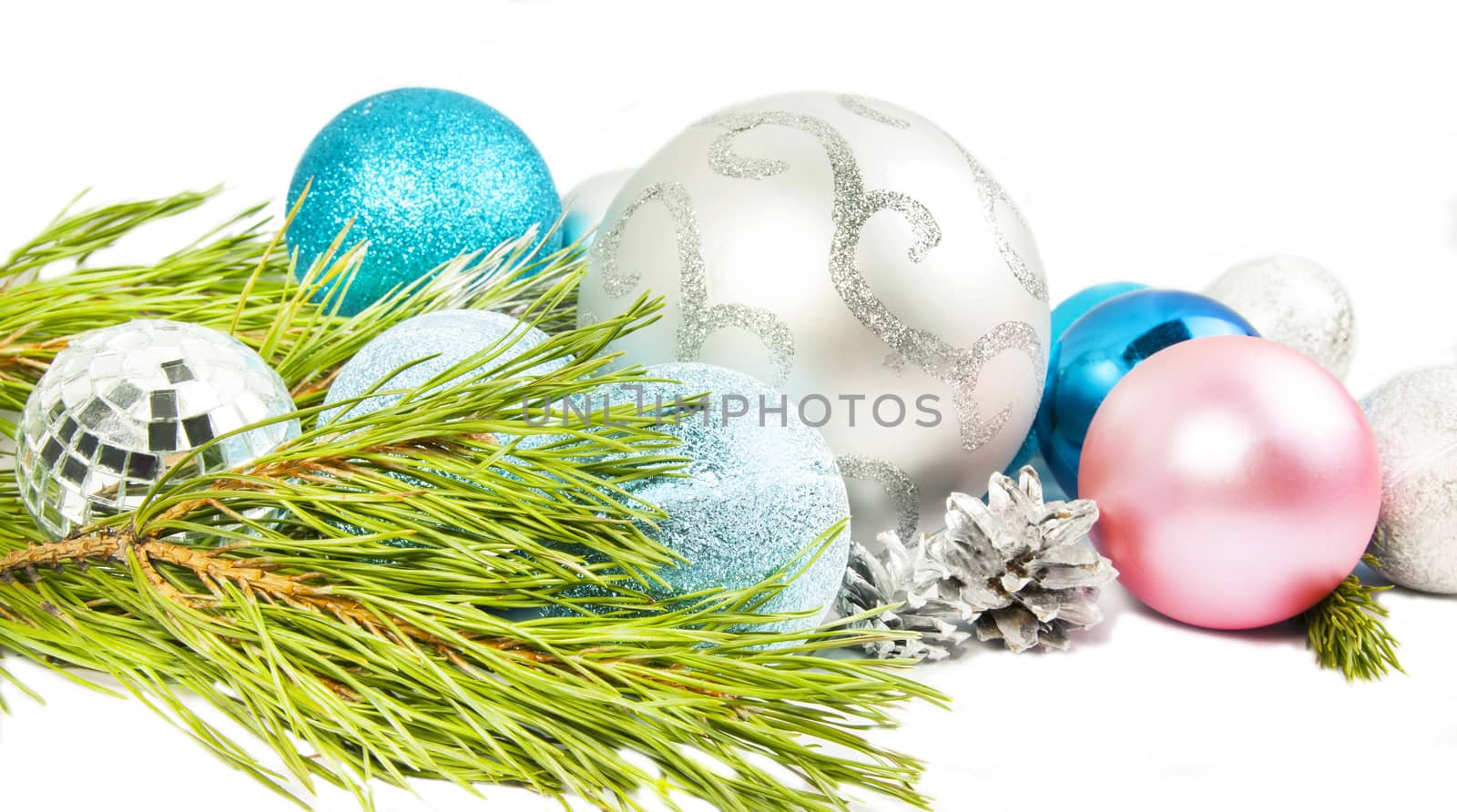 New year and Christmas composition with fir tree branch, beautiful silver ball and silver cones isolated on white