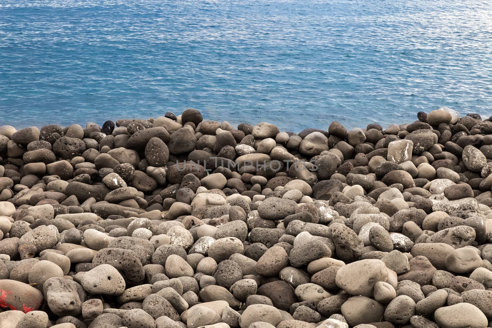 beach of volcanic rocks by alanstix64