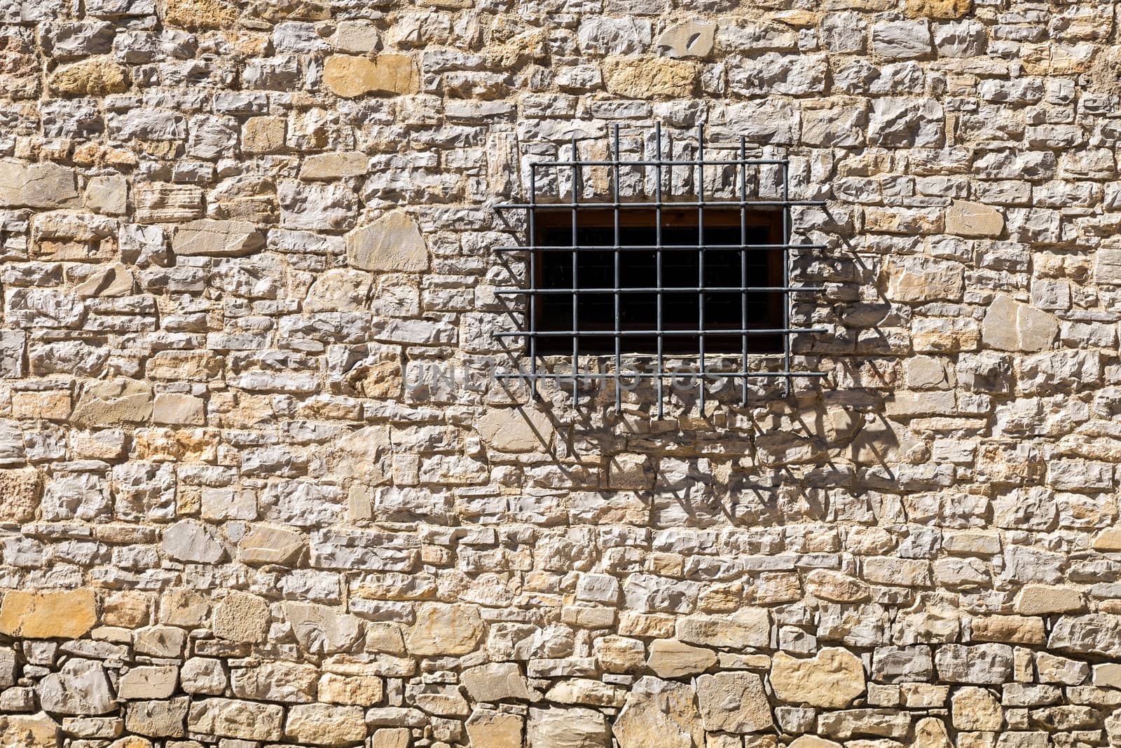 Assisi (Italy): Window on medieval stone wall