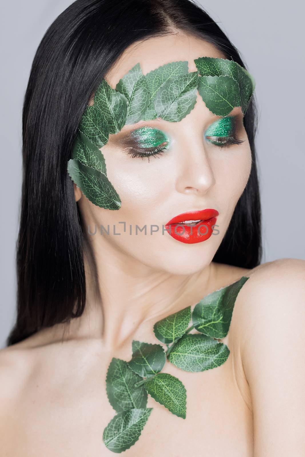 Fashion Art Portrait .Green Make-up and Colorful Bright Nails.