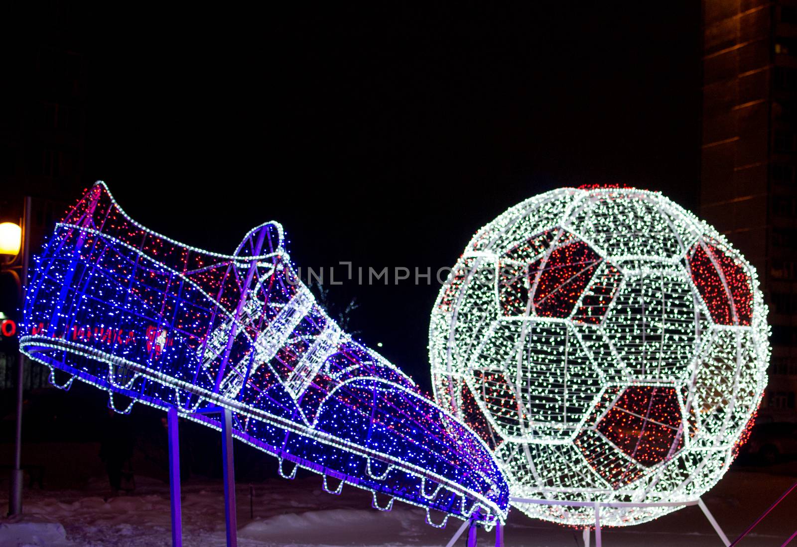 soccer ball and foot of the lights the evening football
