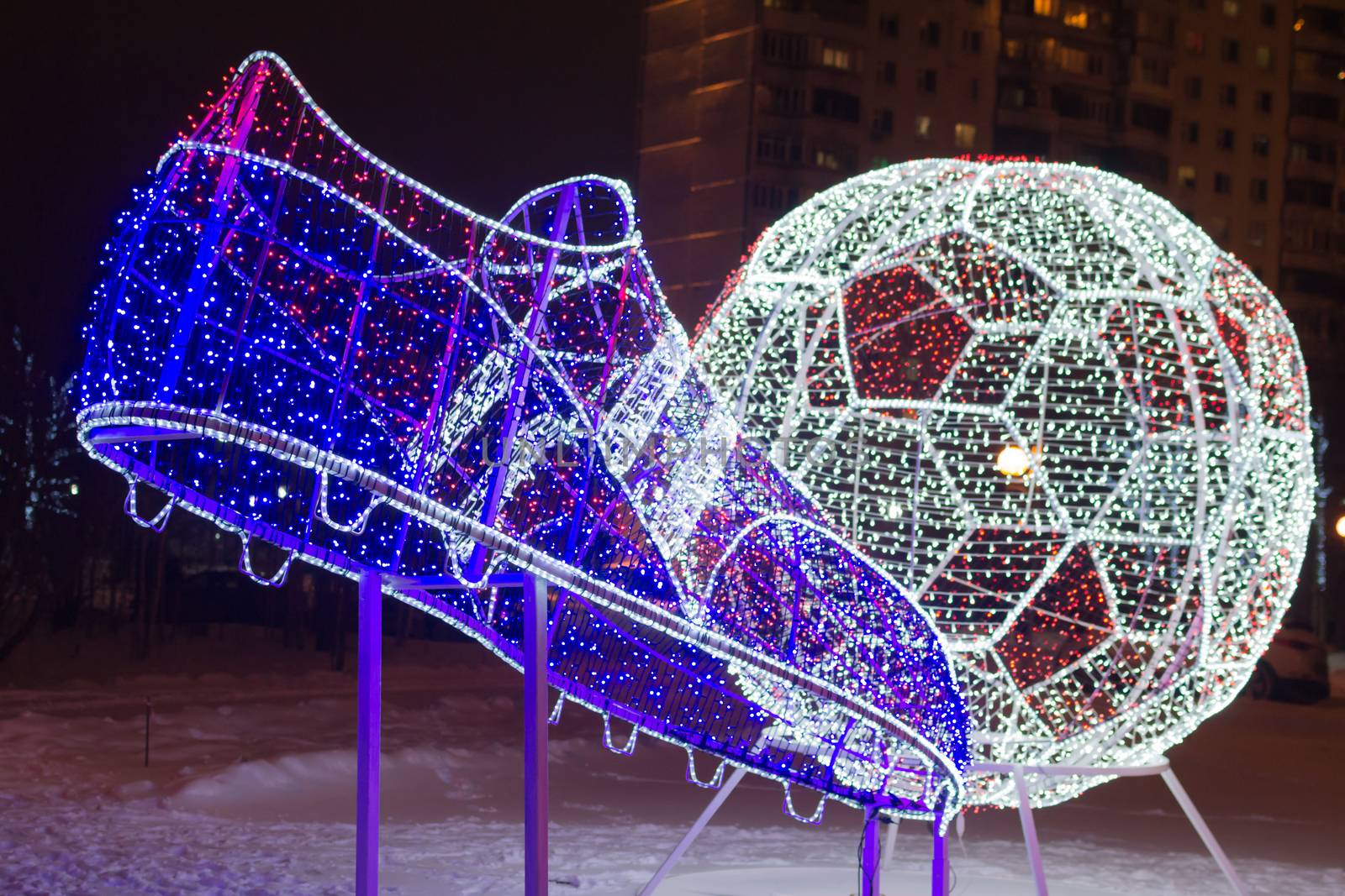 soccer ball and foot of the lights the evening football