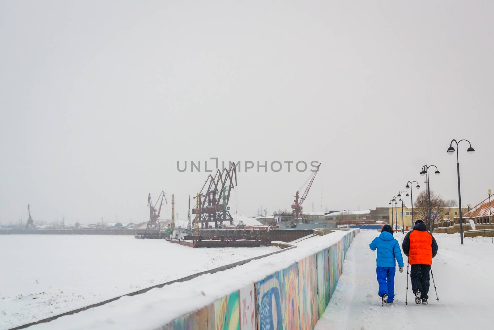 Nordic walking in winter, two people a man and a woman