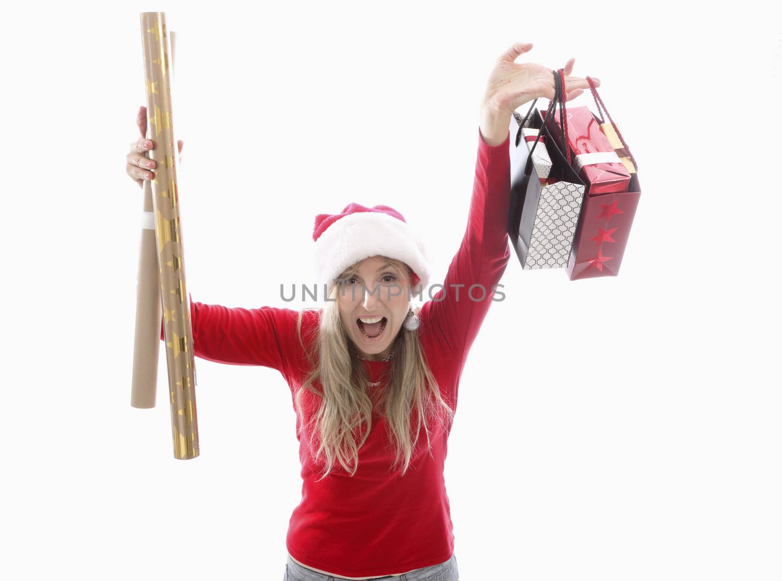 /a woman holding Christmas gifts bought at the shop and gold and kraft wrapping paper